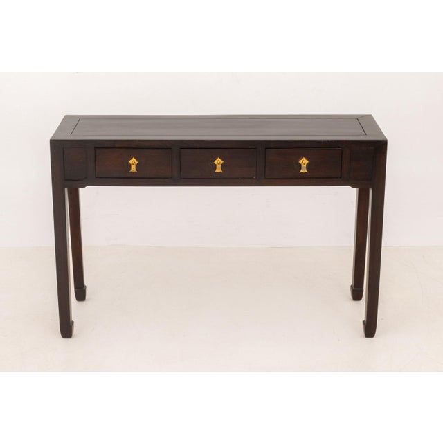 Chinese Hardwood Console Table, with three short drawers and brass drawer pulls. 31.5" H x 48.5" W x 15.5" D. Provenance:...