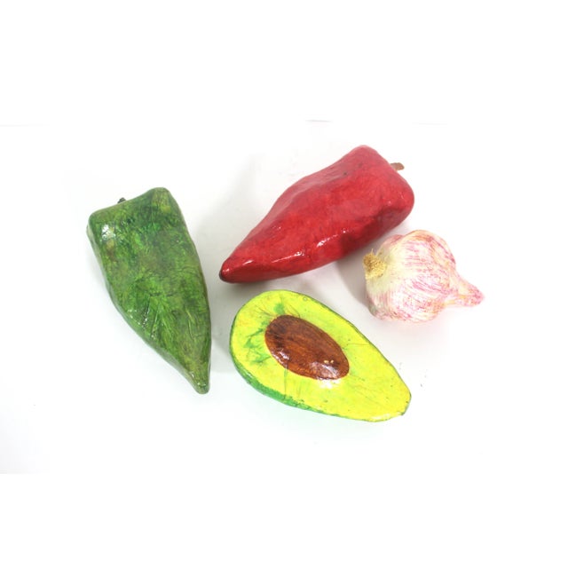 Beautiful set of 4 vibrant paper maché vegetables. Includes garlic, red pepper, green pepper and avocado. Great kitchen or...