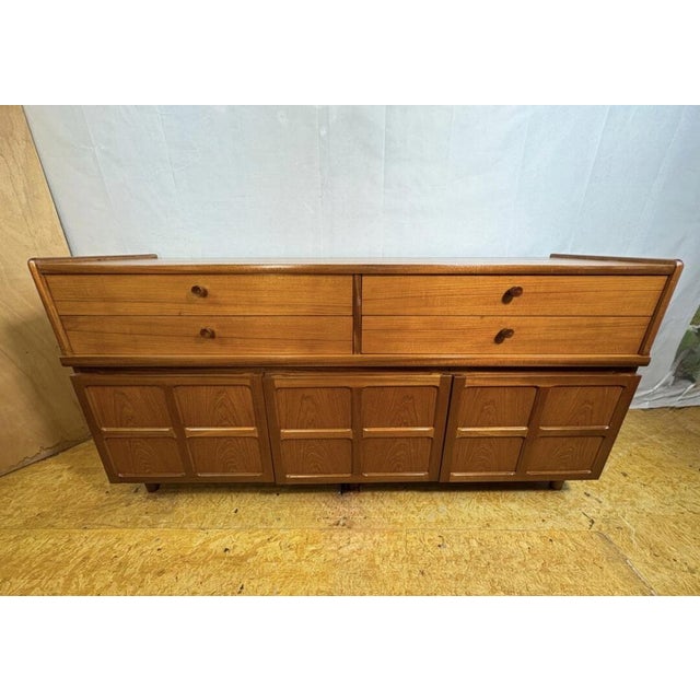 A stylish and highly versatile mid century modern teak sideboard by nathan, dating from the 1960s–1970s and featuring the...