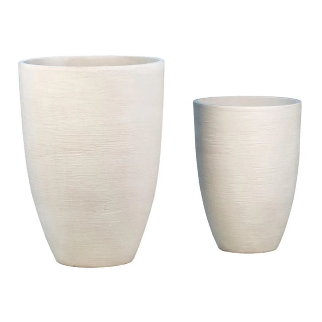 Modern outdoor planter with the look of modern cement without the weight. Easy to use and move light weight resin...