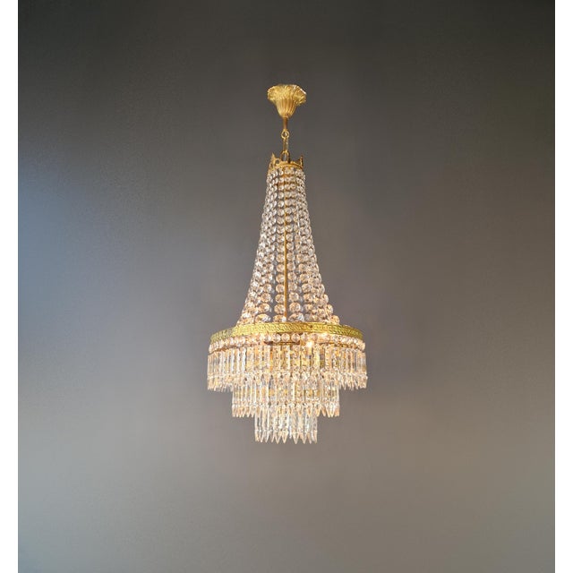Antique Oval Crystal Chandelier in Brass Italy 1922 This stunning antique chandelier originates from Italy and was crafted...
