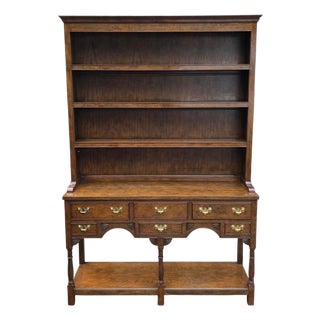 Late 20th Century Baker Furniture Georgian-Style Carved Oak Welsh Dresser With Open Plate Rack [2-Part], Brass Bail Hardware and Turned Supports For Sale