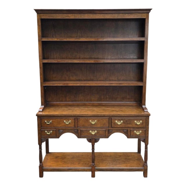 Late 20th Century Baker Furniture Georgian-Style Carved Oak Welsh Dresser With Open Plate Rack [2-Part], Brass Bail Hardware and Turned Supports For Sale