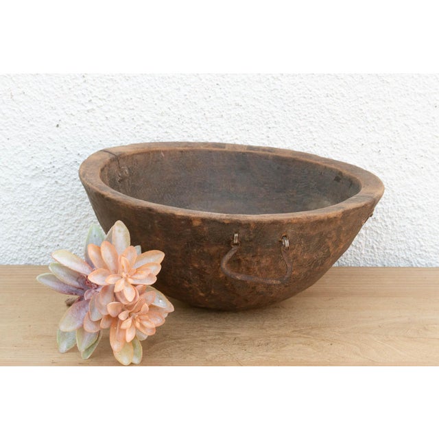 There is something deeply grounding about holding a vessel that was hewn by hand from a single block of wood. This antique...