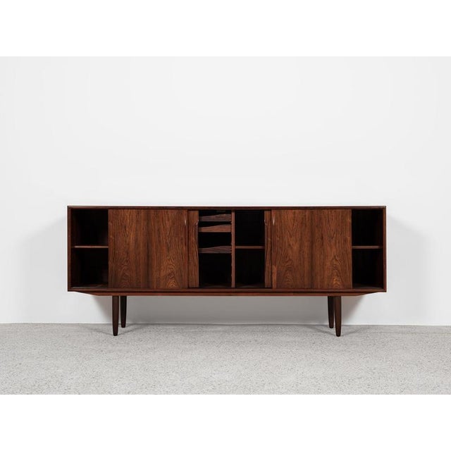 This sideboard is designed by Axel Christensen and manufactured by ACO Møbler in Denmark in the 1960s. This model is often...