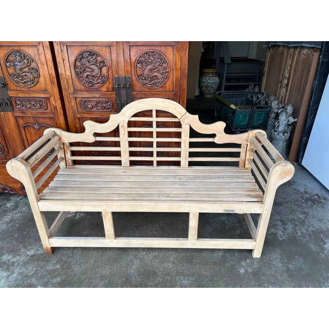Handsome Coventry-labeled teak garden bench featuring an elaborate English Lutyens-style design. The sculptural back is...