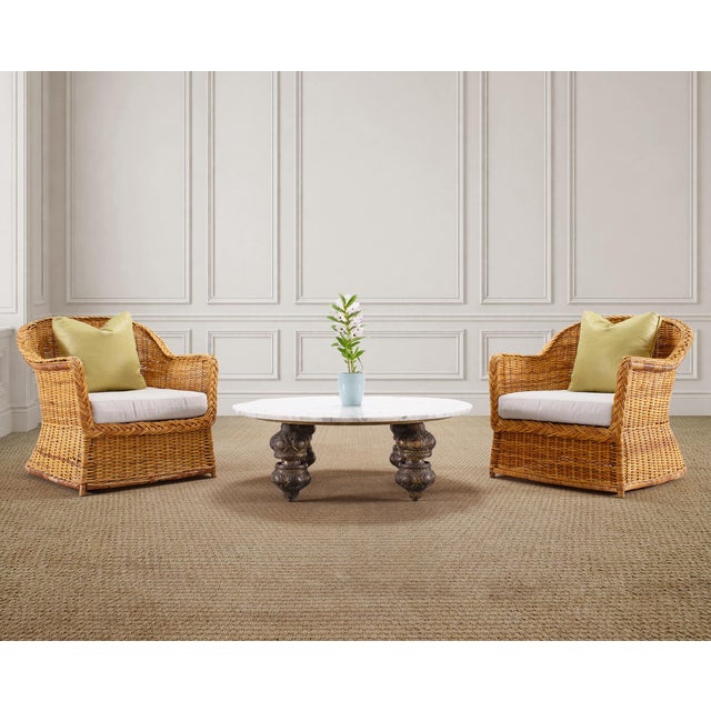 An exotic Moorish Bohemian style coffee or cocktail table pairing a round slab of white Carrara marble with bronze mace...