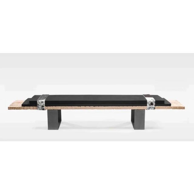 Numero 7 bench by isola design dimensions: w 200 x d 38 x h 34 cm materials: carved raw oak, epdm foam leather, skin, feet...