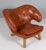Finn Juhl "Pelikan" lounge chair. Legs og oak. Original upholstered with light patinated tan leather. Model Pelikan, made...