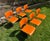 Set of six 40/4 chairs designed by David Rowland. Orange painted metal seats and backs with steel rod frames. Clean,...