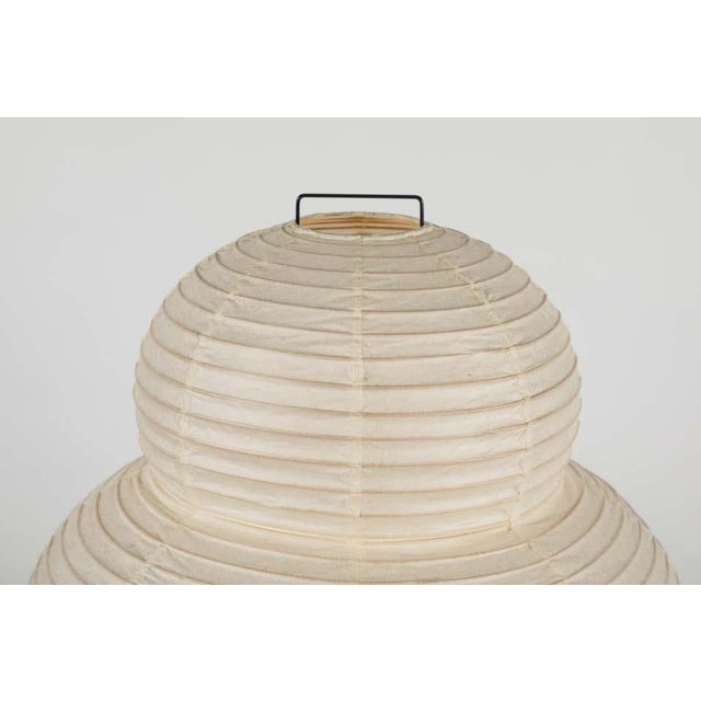 Akari model 24N light sculpture by Isamu Noguchi. Made from handmade Washi paper and bamboo ribs with Noguchi Akari...
