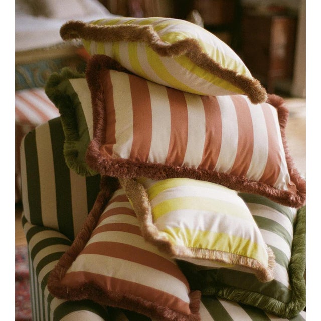 Our 100% yarn dyed Indian Cotton oblong Sonia cushion has a complementary colored ruche trim detail and duck feather insert.