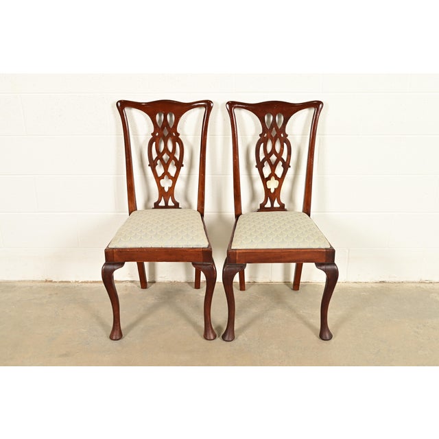 A gorgeous pair of Georgian, Chippendale, or Queen Anne style side chairs or dining chairs In the manner of Henredon USA,...