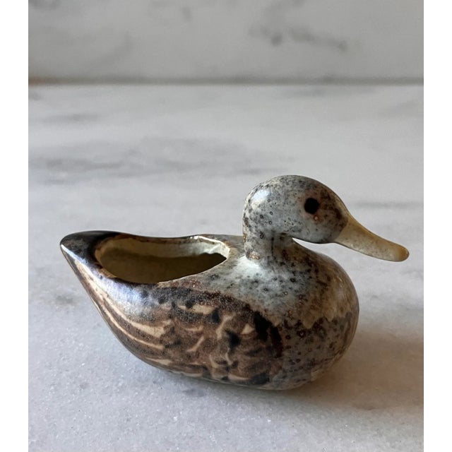 Sweet little hand painted pottery planter or votive candle holder in the shape of a duck. Believed to be Danish, marked on...