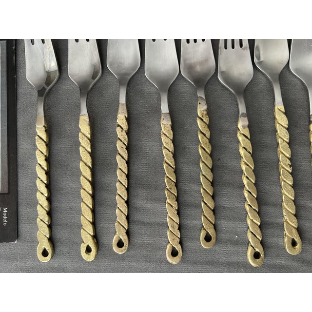 David Marshal. Lot of 34 brutalist style cutlery. from 1980 approx. brass. the largest piece 23.3 cm. some with wear. They...
