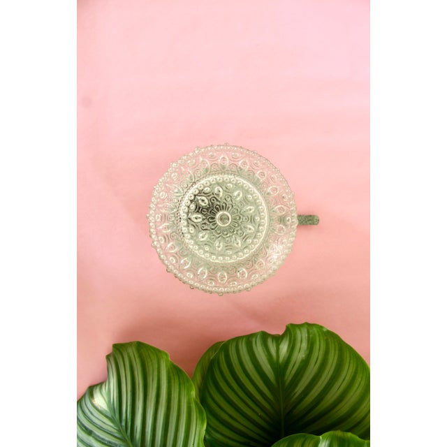 Mandala is a graceful lamp realised in Italy in the early 50s. It is composed by 2 elements: a refined clear wavy glass...