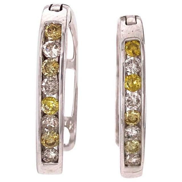 Latch Back Earrings with White and Yellow Diamonds 4.6 grams total weight. 14Kt White Gold 16 Total Diamonds .30