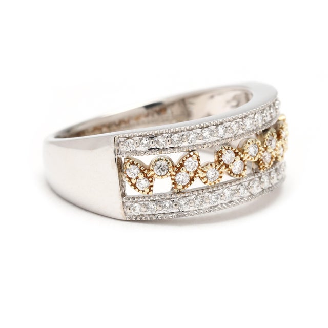 Stones: diamond round brilliant cut 1 - 1.2 mm approximately .36 total carats GH color/ SI1 - I1 clarity Ring Size 6.25...