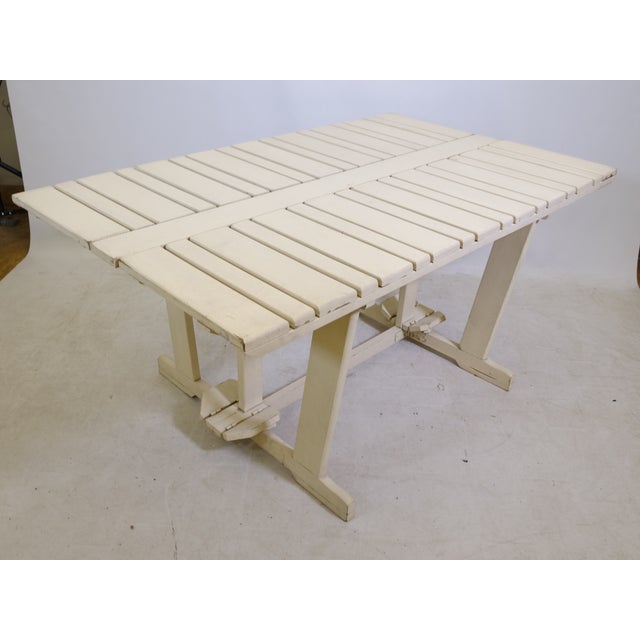 Folding garden table "Riviera" by Triconfort, made entirely of wood with a slatted tabletop in a simple, minimalist...