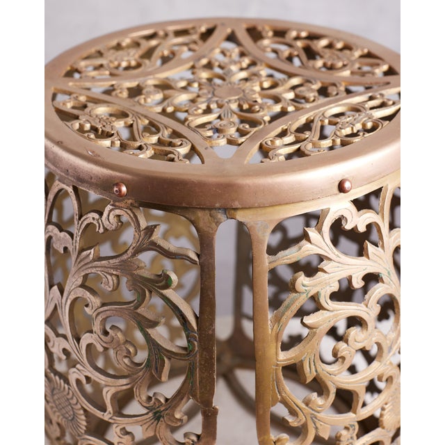 Stunning solid brass stool or table for indoors or outdoors in your garden. This intricate brass design serves as a...