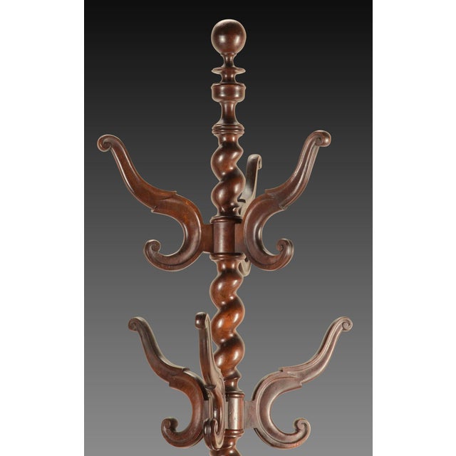 Large 19th Century English carved walnut hat, coat and stick stand. with turned finial and wrythen central column and...