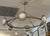 Design Plus Gallery presents the Champagne Bronze Bezel Circle Chandelier from West Elm. This round light fixture has...