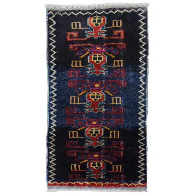 A mini size Turkish rug from the third quarter of the 20th century Measures: 1'6” x 2'8".