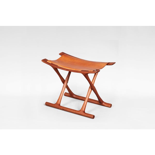 A refined example of danish modernism, this egyptian stool was designed by ole wanscher in 1957 and produced by pj møbler...