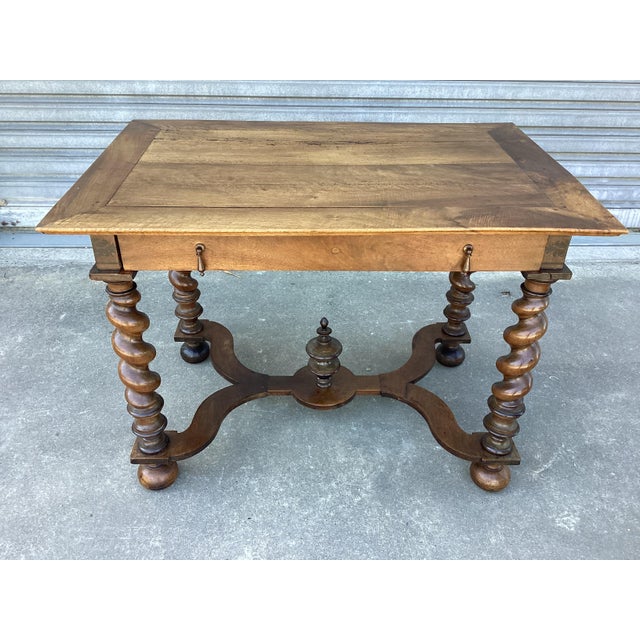 This French antique walnut desk/table features a stunning patina, created over time. In very good condition, the top is...