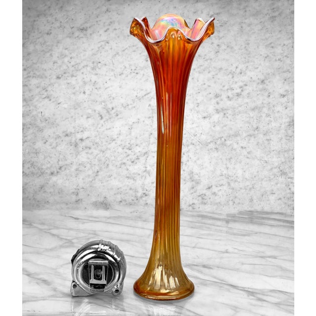 A Large Marigold Iridescent Carnival Art Glass Swung Vase, c. Mid 20th Century. This Vase would look exceptional while...