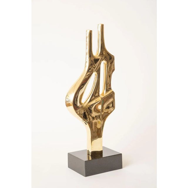 This lovely vintage brass and black granite tall abstract figural sculpture has a great presence. It can be placed in...