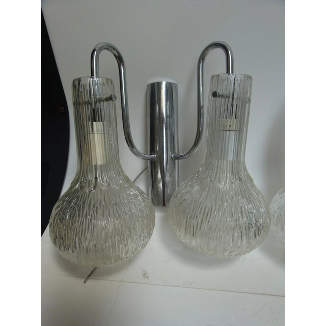 - 1960s wall lights - Made in Italy - Nickel-plated steel structure - Blown glass shades Up to 250V (Europe/UK...