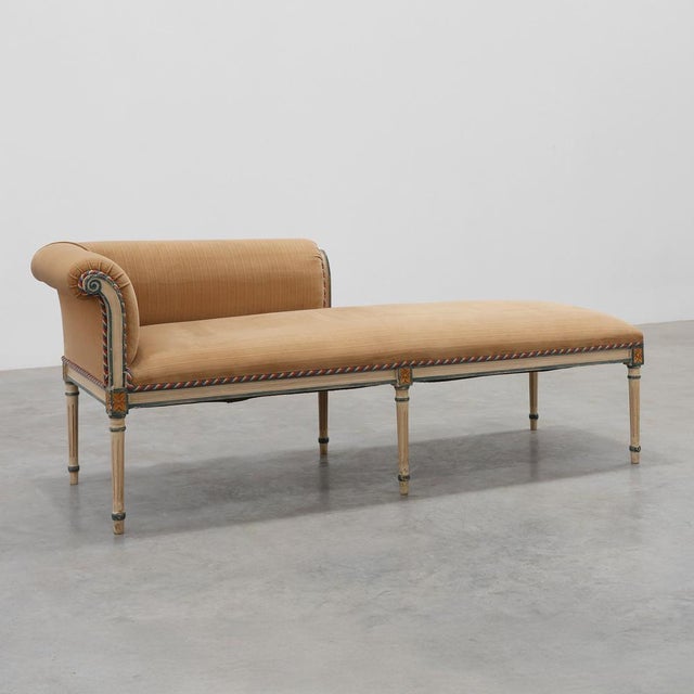 Exuding timeless refinement and grand European charm, this elegant French neoclassical style chaise longue—or...