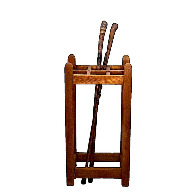 Offered is an Oak wood umbrella and cane stand in the style of Stickley pieces from the Arts & Crafts and Mission era of...