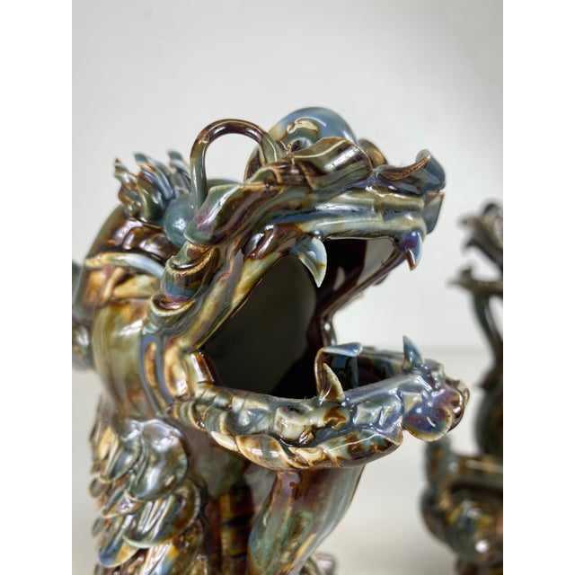 This is a mid-century vintage magnificent pair of large majolica pottery dragons. This pair of Chinese export pottery...