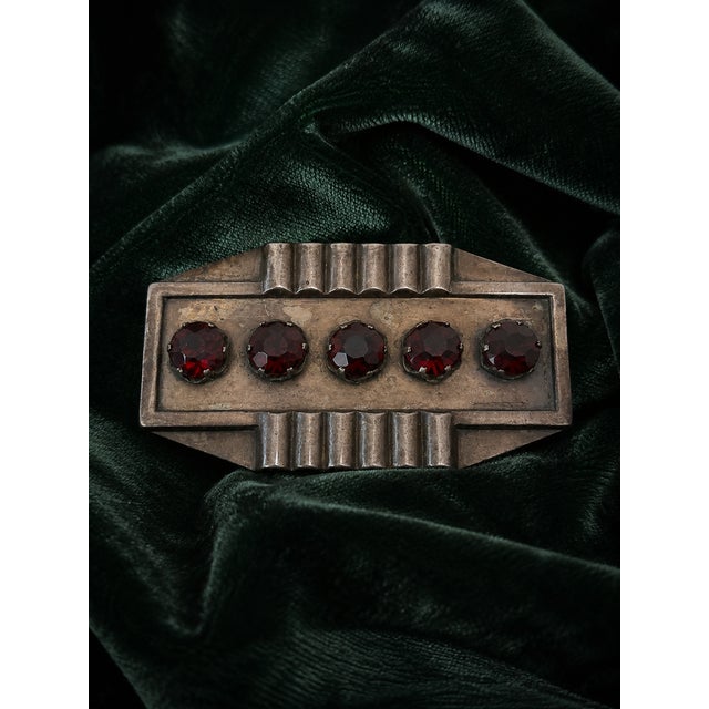 A rare and striking european art deco revival statement brooch bearing the impressed block-letter mark “erte” on the...