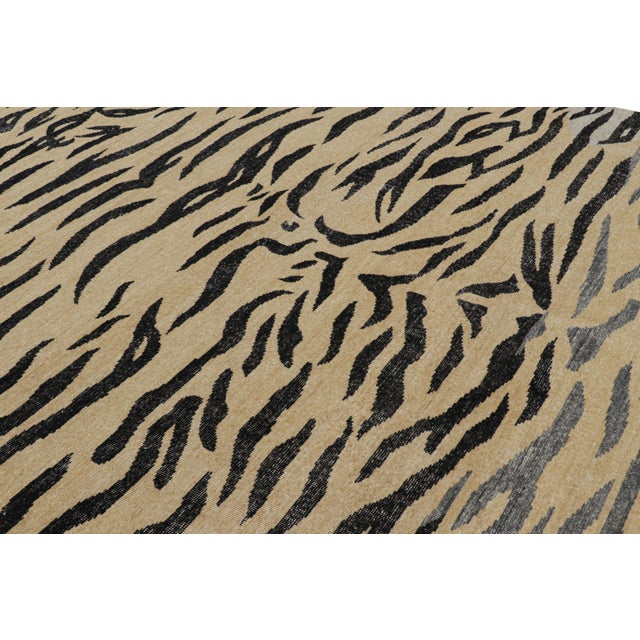 This hand-knotted wool 9x12 tiger rug design is a bold new addition to Rug & Kilim’s Homage Collection. On the Design:...