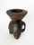 A three-sided carved wooden ashtray, a French handcrafted piece from the 1960s with a raw and expressive character. This...