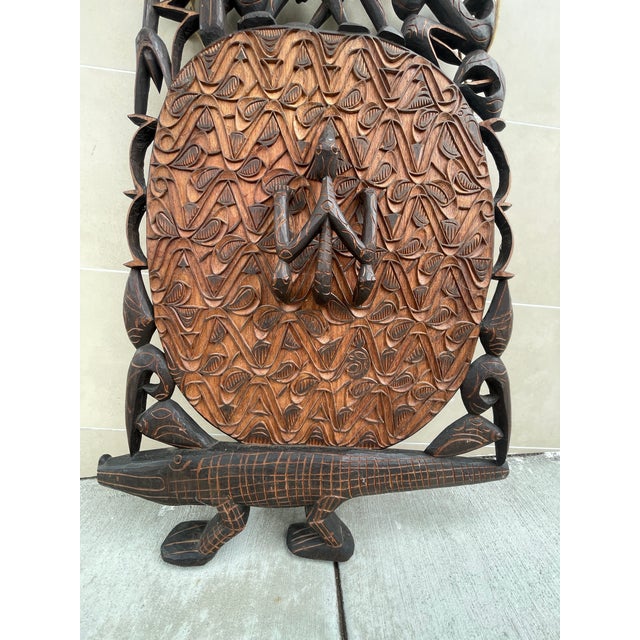 This authentic Asmat wood panel showcases traditional architectural and ceremonial carving traditions from Southwestern...