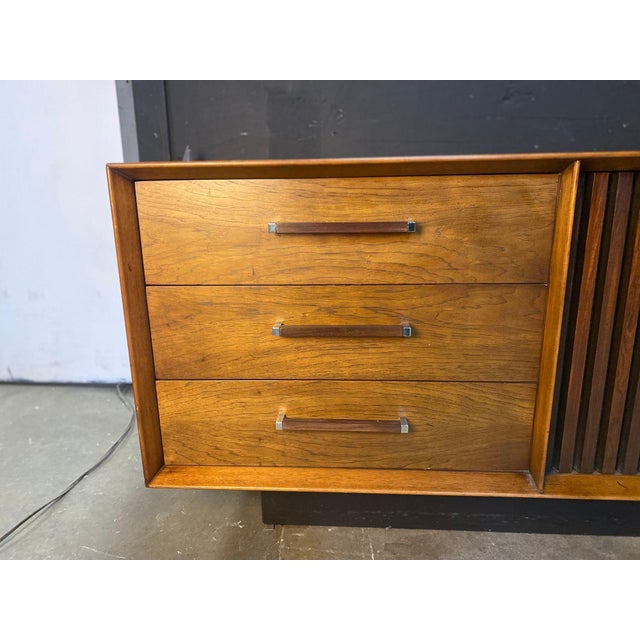 Here is a beautiful Rosewood & Pecan Long dresser, designed in the early 70's by Dave Parmalee as Part of the "Toer Suite"...