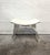 Contemporary Marlowe stool featuring a contoured white leather seat supported by sweeping arches of clear Lucite. The...