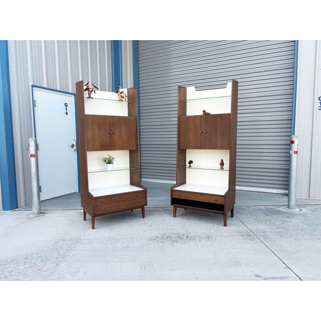 This exceptional pair of Mid-Century Modern bookcases, designed by Kipp Stewart for Glenn of California and made in the...