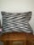 Black and white poka-dotted pillow with a grey and white zig-zag pattern for the back. Pillow has a hidden zipper for...