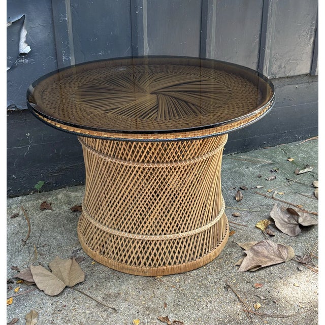 1970s natural spun wicker coffee table w/ smoky glass top. Excellent condition.