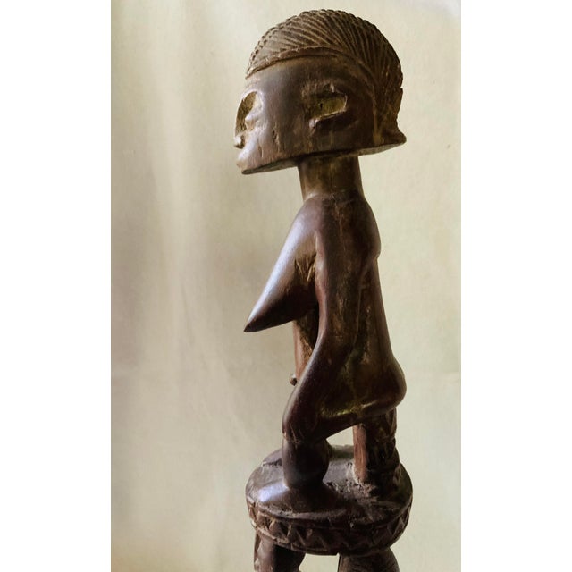 Command presence in your interior styling with this exceptionally heavy, multi-tiered mid-century hand-carved African...