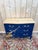 A louis xv style three-drawer commode, hand-painted in the workshop in royal blue with applied gold leaf in a diagonal...