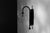 A bubble of mouth-blown glass hangs inverted on an arched stem: a nocturnal flower from the landscape of Naples bay....