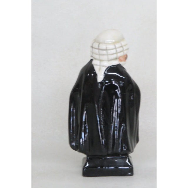 This wonderful miniature figurine is made out of bone china. This lovely piece is stamped as being made by Royal Doulton...