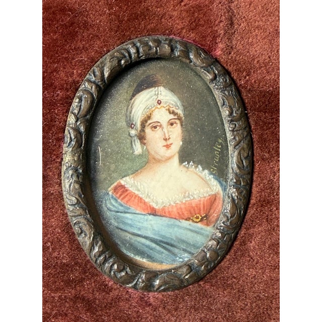 This antique 19th century miniature painting depicts an Austrian woman, showcasing the intricate details and craftsmanship...