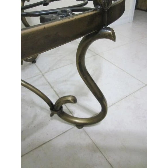 This Italian-style coffee table features an ornate glass top that adds a touch of elegance to any living room. The oval...